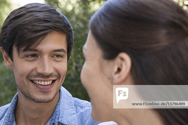 Young man smiling at girlfriend