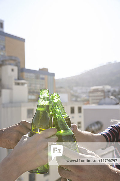 Friends having a drink on a rooftop terrace