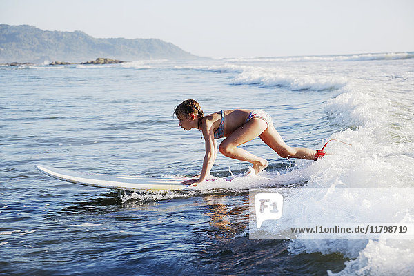 Girl surfboarding