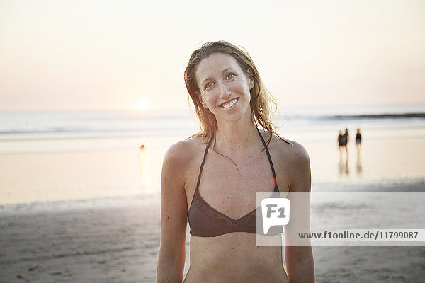 Smiling woman on beach