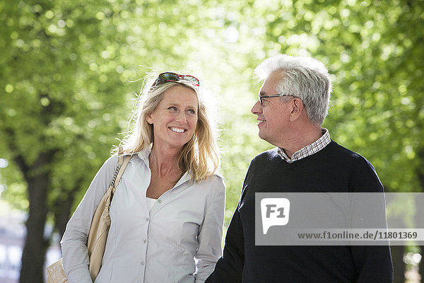 Mature couple walking in park