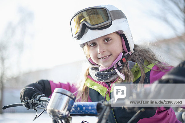 Portrait of girl wearing helmet and goggles