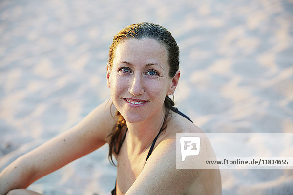 Smiling woman on beach