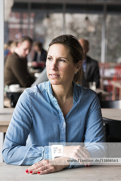 Woman in cafe looking away
