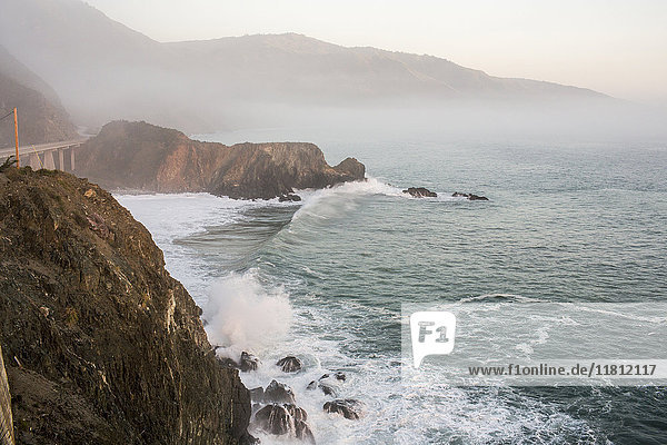 Waves splashing on rocks at cliffs
