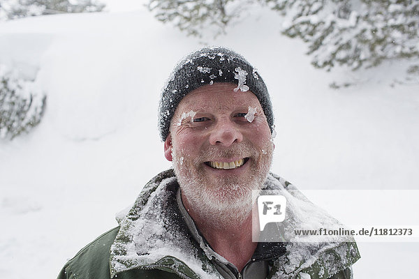 Caucasian man covered with ice and snow