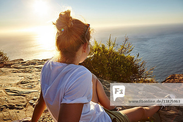 Young woman relaxing looking at view  Lions head Mountain  Western Cape  Cape Town  South Africa