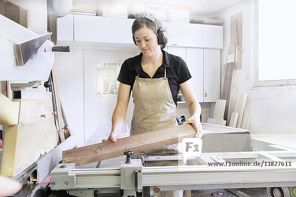 Female carpenter working in workshop