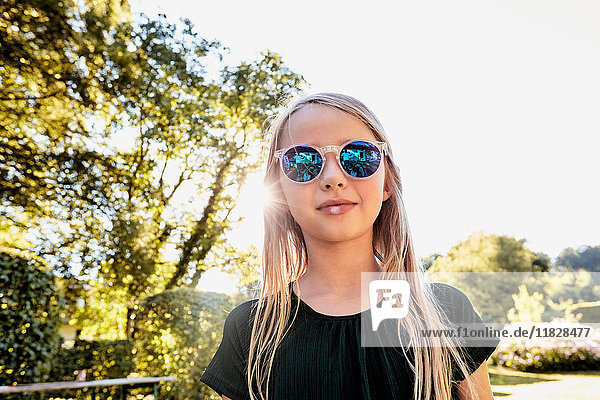 Girl in sunglasses enjoying sunny day