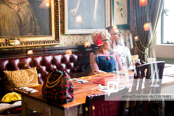 Quirky couple relaxing in bar and restaurant  Bournemouth  England