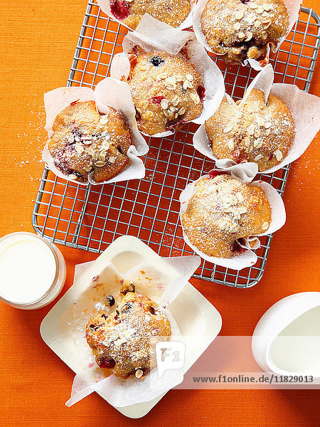 Berry oat muffins on cooling rack