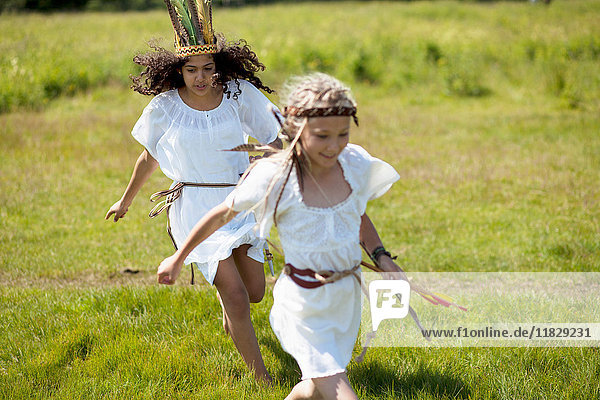 Girls running in Native American costume