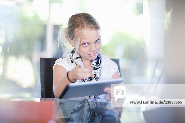 Girl playing businesswoman at desk