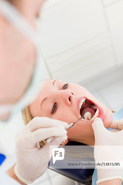Dentist working on patients teeth