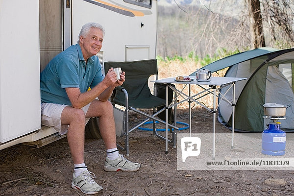 Older man camping with RV