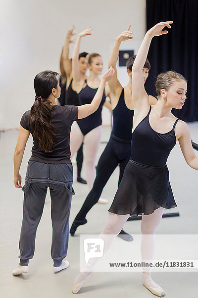 Ballet dancers practicing at barre