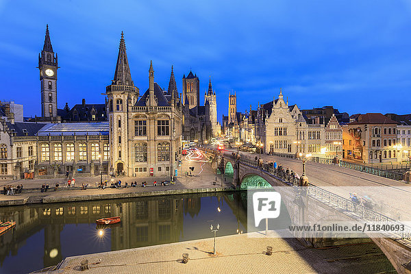 View of the historic area of Graslei and bell tower along Leie river at dusk  Ghent  Flemish Region  East Flanders  Belgium  Europe
