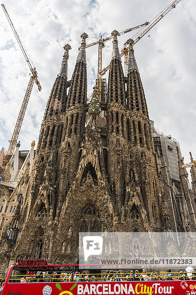 'Tour bus and Sagrada Familia (Gaudi) downtown Barcelona; Barcelona Catalonia Spain'