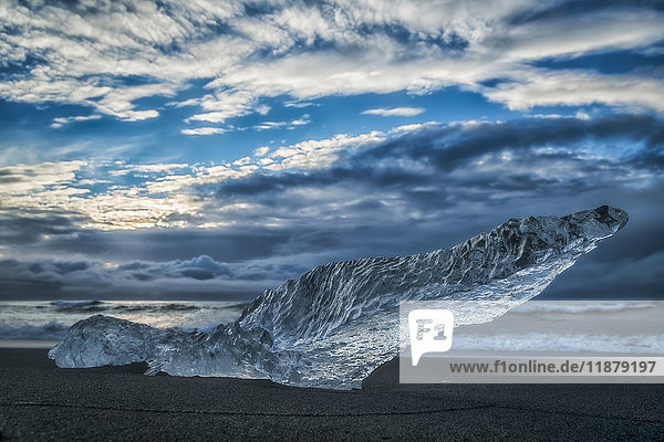 'Diamond Beach along the South Coast of Iceland and is an area where ice chunks from Jokulsarlon are deposited on the beach after each high tide; Iceland'
