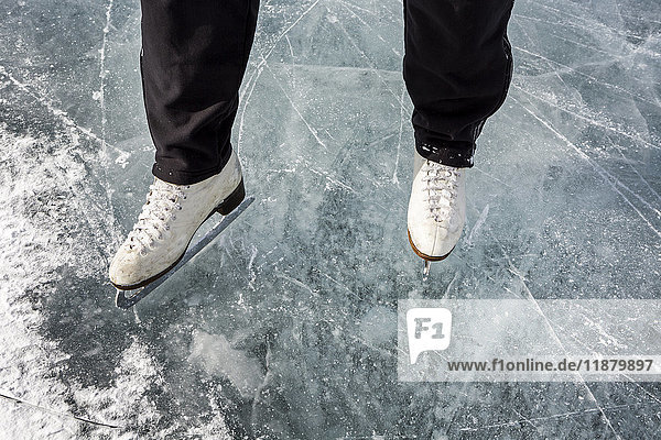 'High angle view and close-up of white figure skates on ice; Calgary  Alberta  Canada'