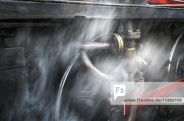 Dust blurs the wheels of a railroad car; North Yorkshire  England