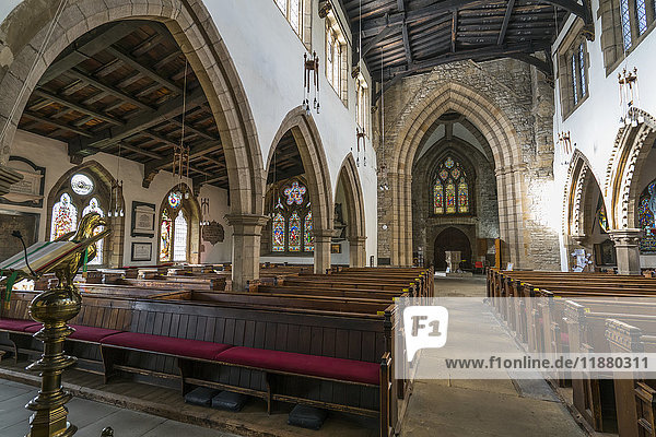 Interior of a church viewed from the altar  with wooden pews and arches; Yorkshire  England