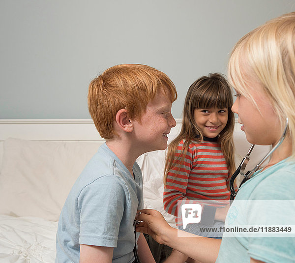 Children playing doctors with stethoscope