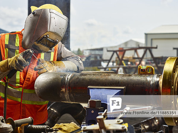 'A welder works on pipes; Edmonton  Alberta  Canada'