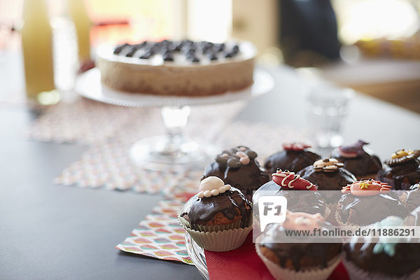 High angle view of cupcakes on stand at dining table
