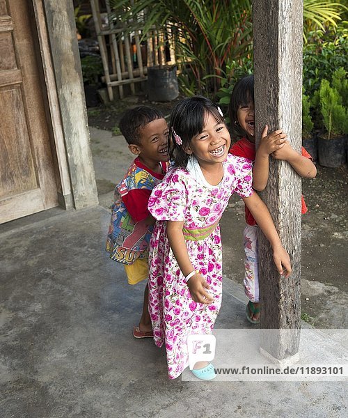 Three cheerful Indonesian children  Yogyakarta  Java  Indonesia  Asia