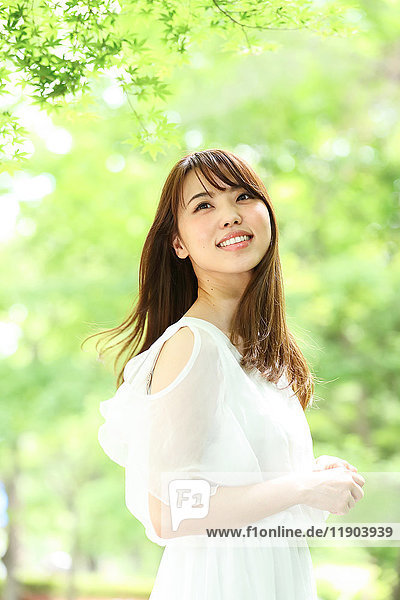 Young Japanese woman in a city park