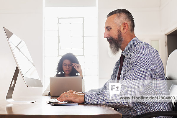 Man using computer desk