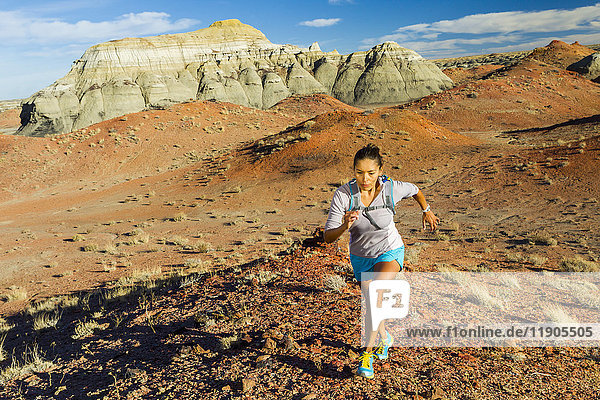 Native American woman running in desert