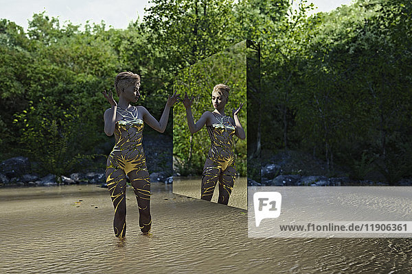 Reflection of woman in virtual mirror standing in river