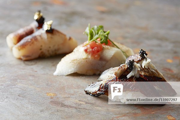 Closeup of fresh sushi on rustic wooden table