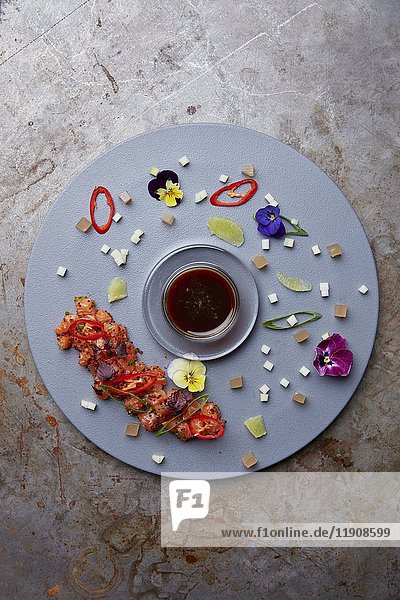 Salmon sashimi served artistically on a plate (Japan)