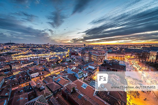 Evening in Porto  second largest city in Portugal. Aerial view from bell tower of Clerigos Church with Douro River.