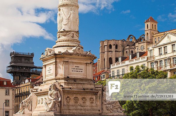 Column of Pedro IV  on background view of the Santa Justa Lift or Carmo Lift  and apse of the Carmo Convent  Rossio Square or Pedro IV Square  Lisbon  Portugal  Europe.