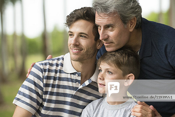 Mature man with son and grandson  portrait