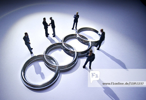 Audi logo surrounded by model figures