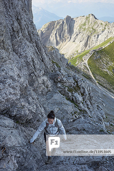 Alps  Karwendel Mountains  woman hiking at Via ferrata