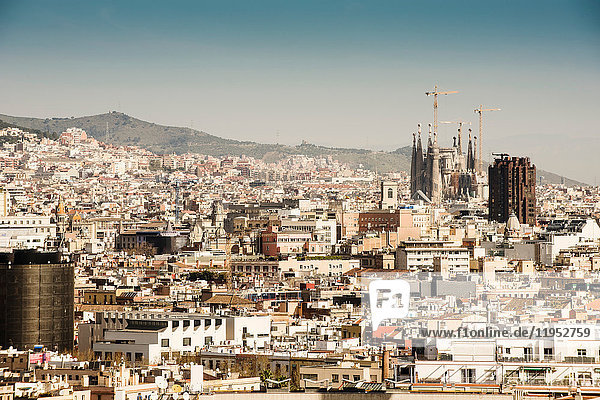 Cityscape view with Sagrada Familia and construction cranes  Barcelona  Spain
