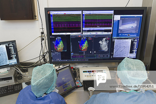 Reportage in the Interventional Cardiology and Rythmology service in Saint George Clinic in Nice  France. Radiofrequency ablation of cardiac arrhythmia using the Stereotaxis robotic system. This operation consists of inserting a catheter into the heart  emitting radio waves that will cauterize cardiac tissue responsible for rhythmic irregularity. The Stereotaxis robotic system is a magnetic navigation system. It uses a rotating magnetic field enabling the ablation catheter to be guided from a distance. The system consists of two giant magnets placed on each side of the operating table. The operation is carried out under radioscopic control. It is a more precise technique that reduces the risk of complications  procedure length and the patient’s and radiologist’s exposure time to x-rays. Treating a patient suffering from a left atrial flutter. Doctor in the control room during the ablation.