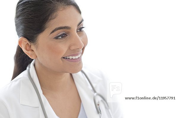 MODEL RELEASED. Female doctor smiling and looking away  portrait.