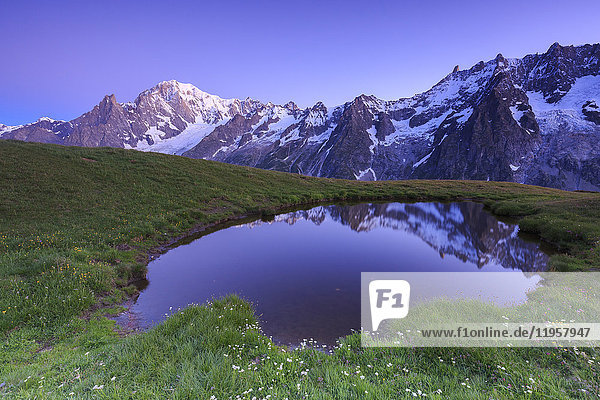 Twilight illuminates Mont Blanc Mont de la Saxe Ferret Valley Courmayeur Aosta Valley Italy Europe