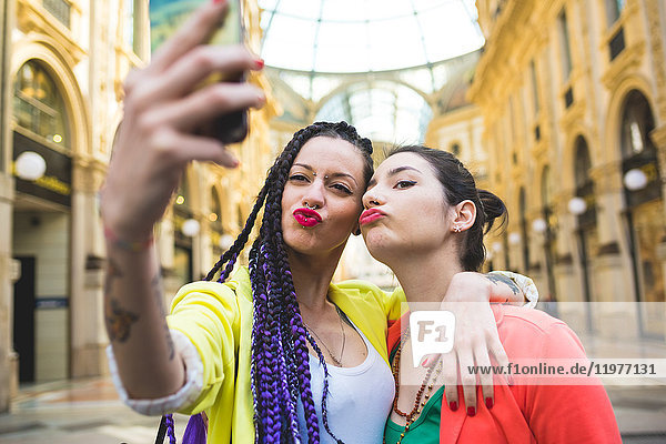 Women taking selfie in the Galleria Vittorio Emanuele II  Milan  Italy