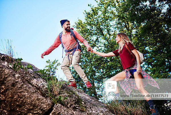 Couple hiking on rocks  Krakow  Malopolskie  Poland  Europe