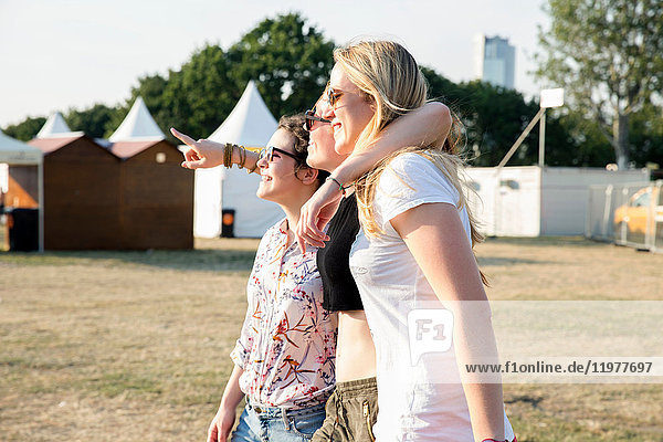 Three female friends enjoying festival