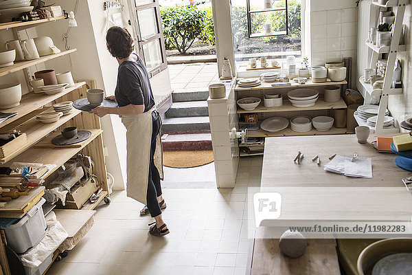 Potter working in studio