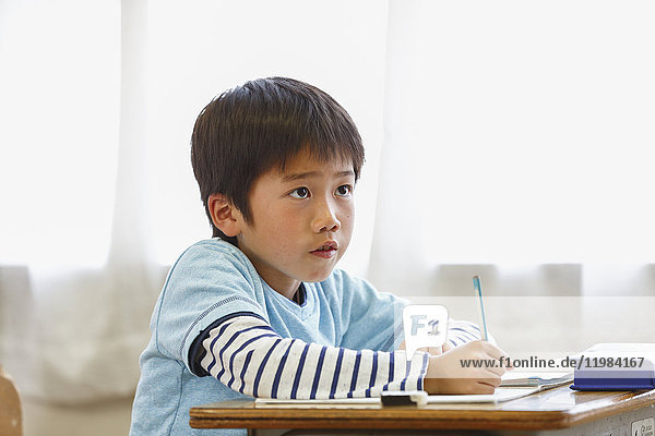 Japanese elementary school kid in the classroom